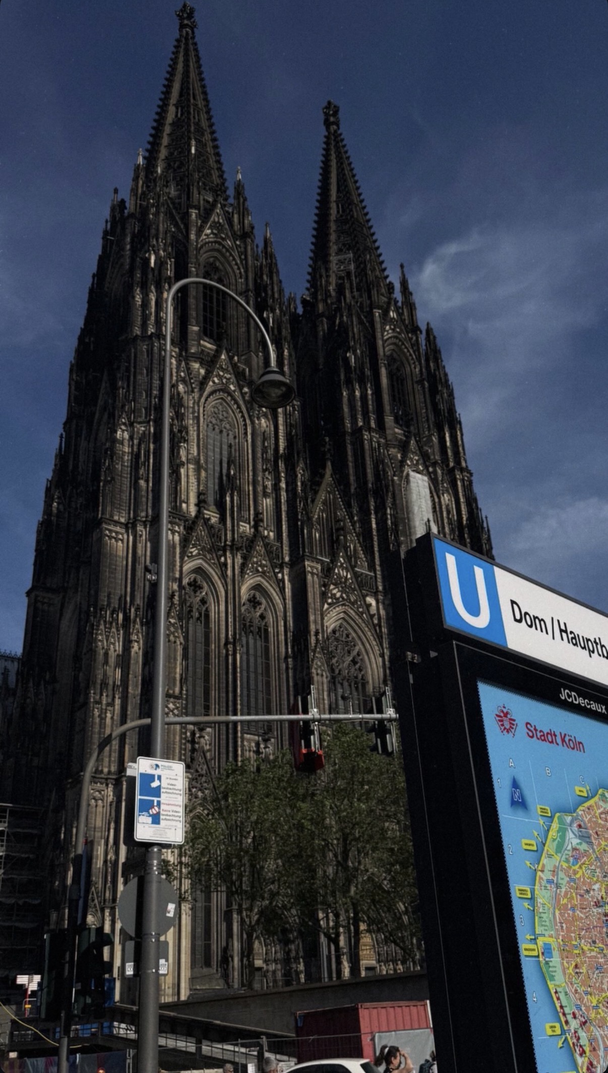 A Gothic cathedral rising over an underground station entrance