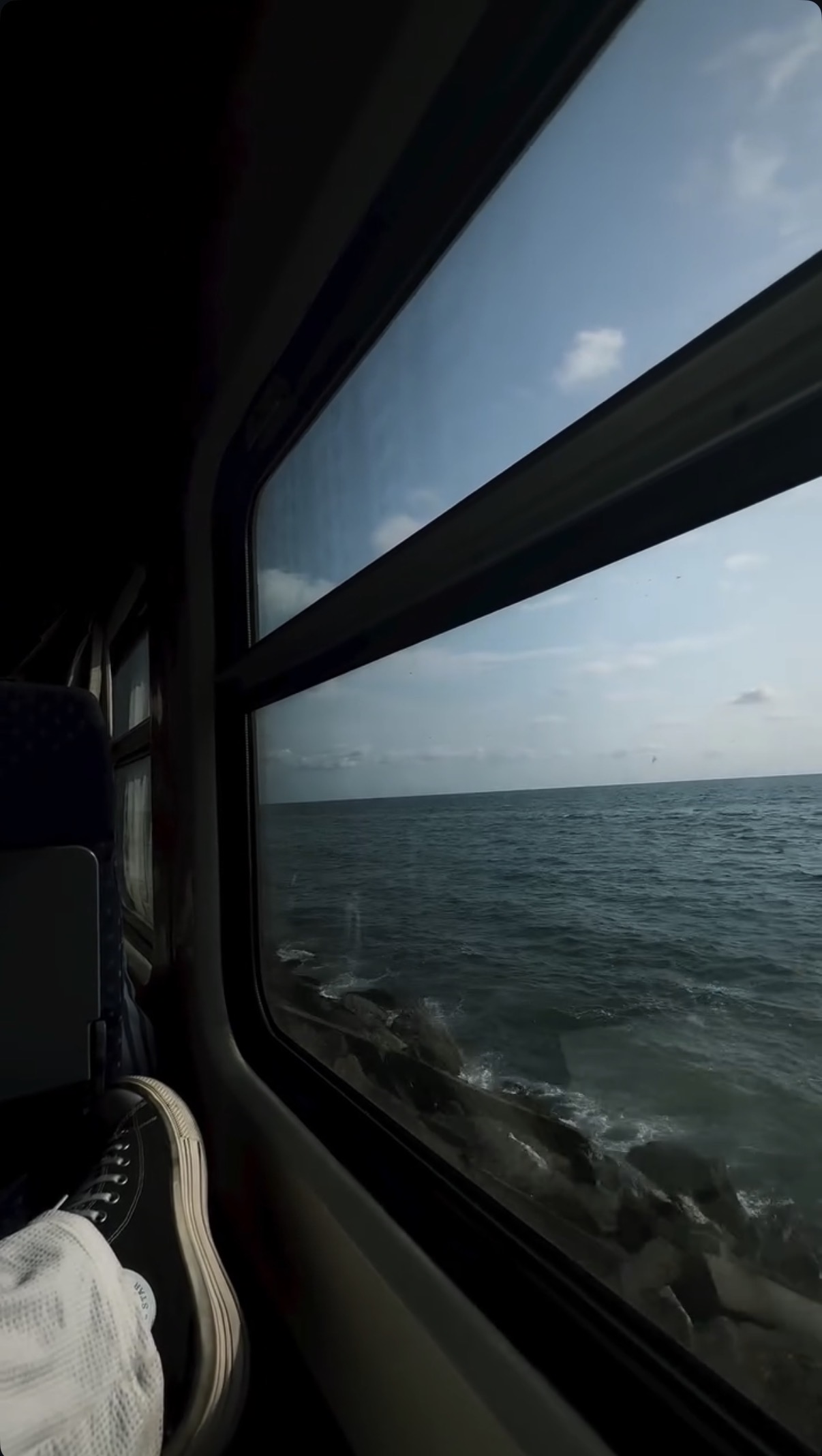 The sea seen through a train window